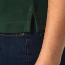 Polo mit kurzen Ärmeln und kontrastierenden Biesen - Bild 14